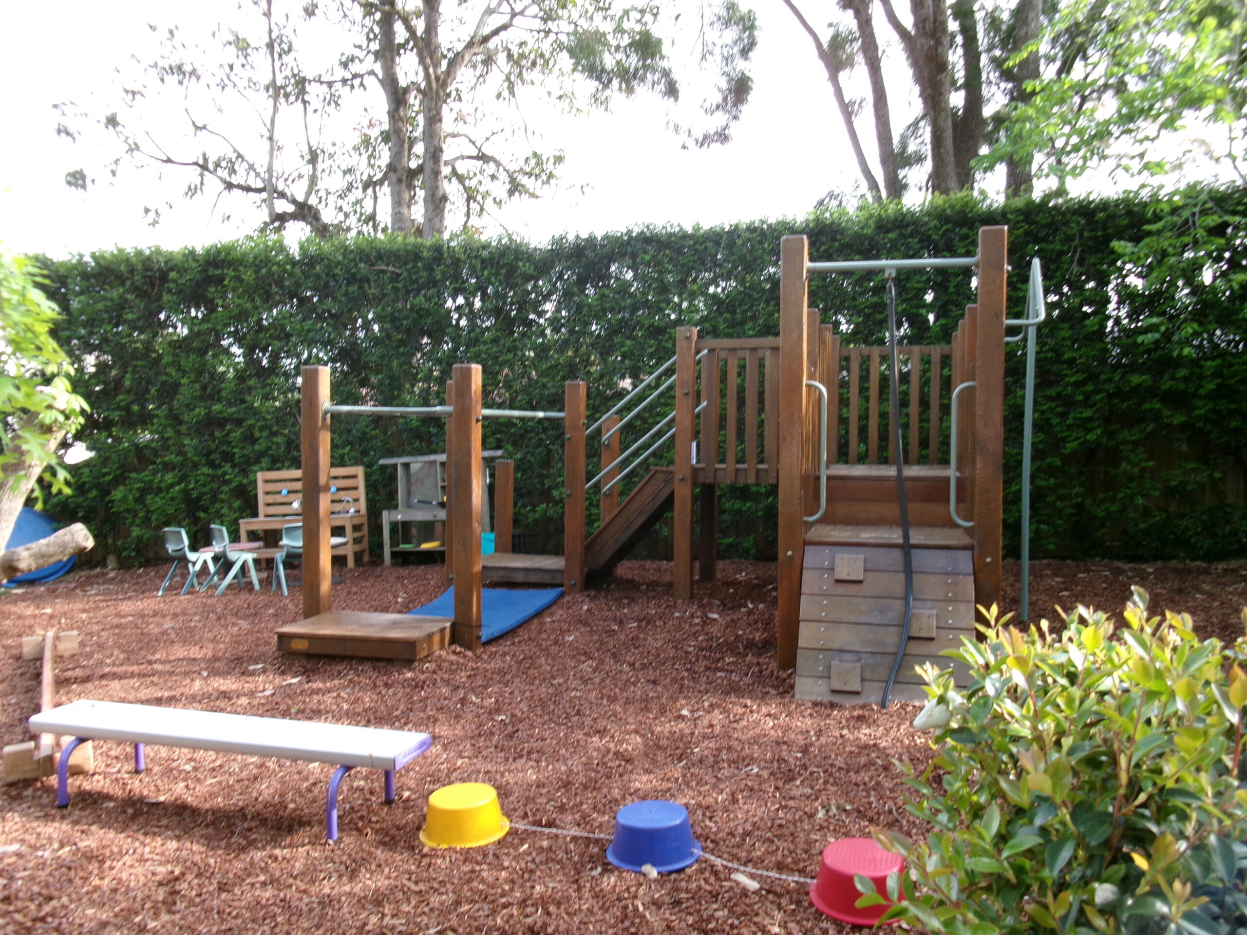 Timber climbing equipment in our leafy preschool playground